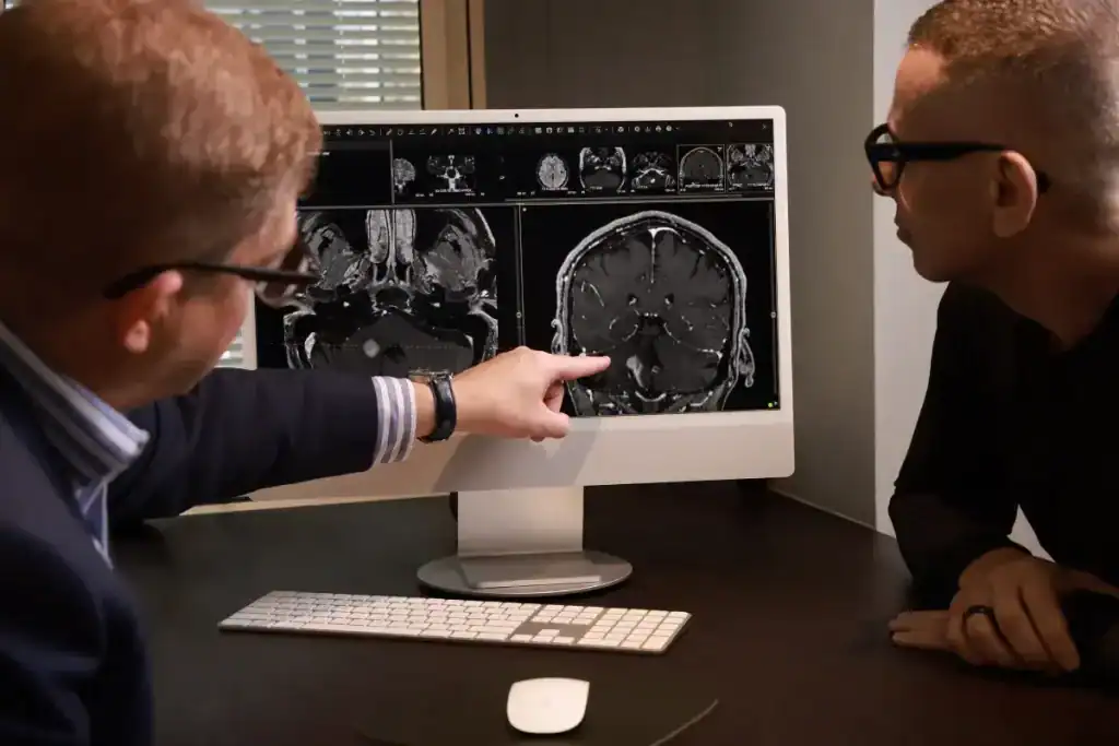 Medical professionals reviewing brain MRI scans for tumour diagnosis.