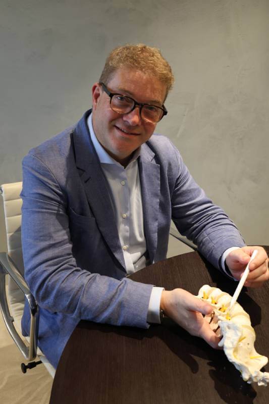 Dr Jacob Fairhall providing dental care in a professional setting.